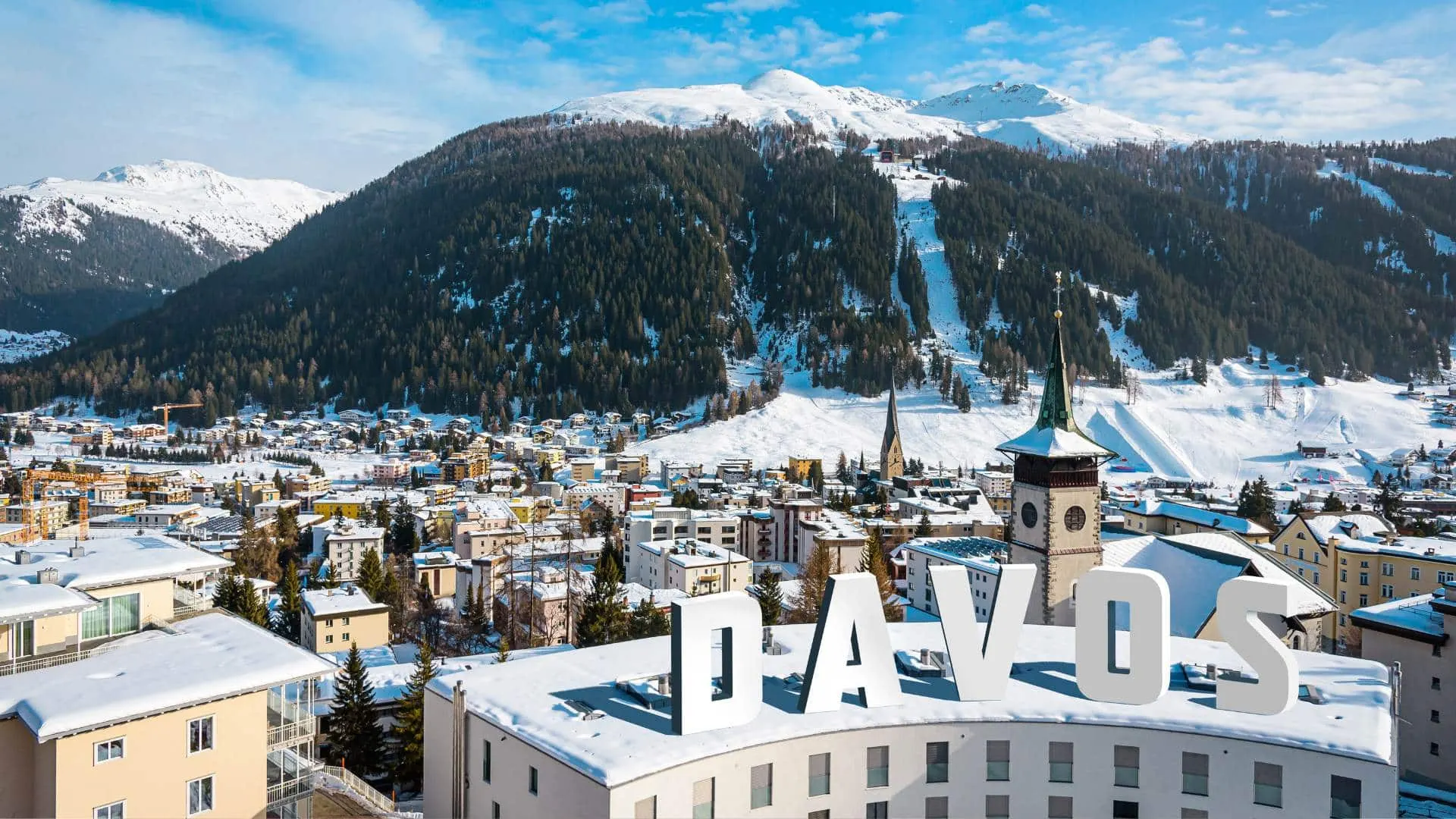 Davos in winter, snow on the rooftops along the valley
