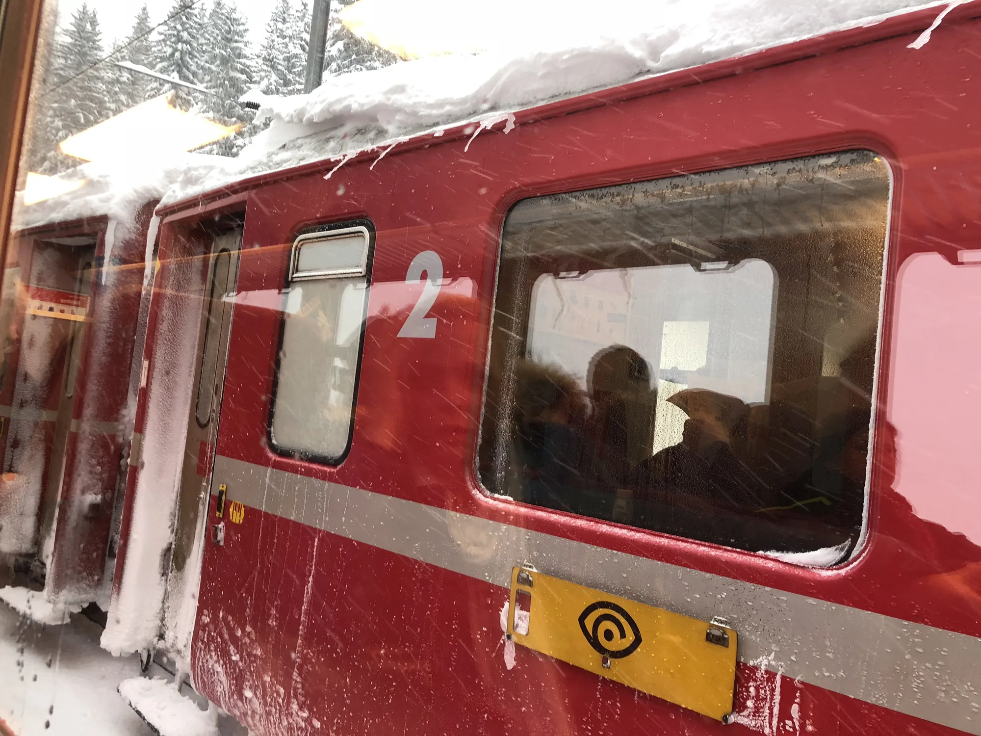 A Rhaetian Railway carriage stopped in the snow near Davos