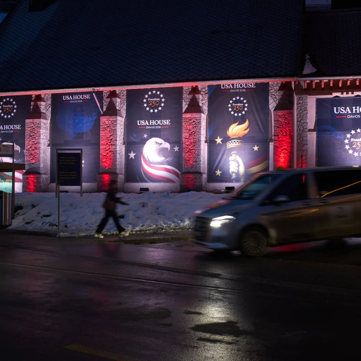 A House lit up on the Davos Promenade at night during Annual Meeting week