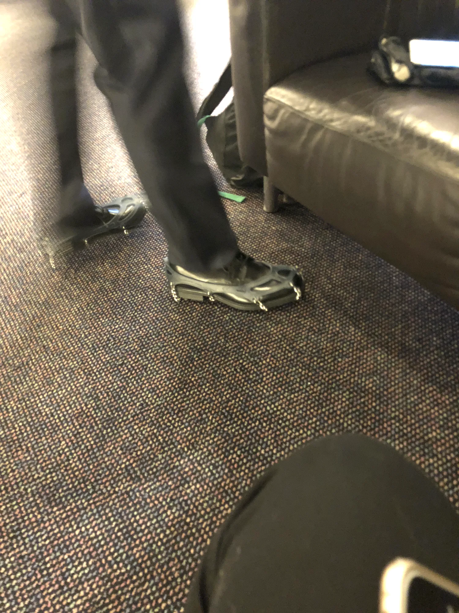 Ice cleats strapped over shoes for grip on packed Davos snow